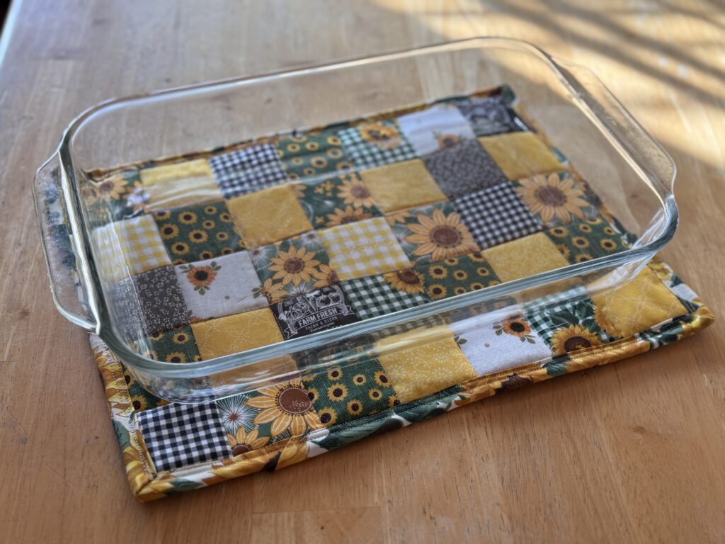 Oversized hot pad made with traditional patchwork to fit casserole dishes green yellow sunflowers